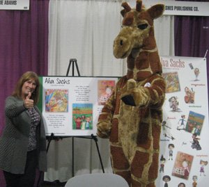 Giraffe, the 2012 Girl Scout cookie mascot, and Alva share a moment together