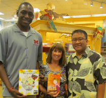 Children's authors Seth Fowler, left, and Alva Sachs with their books and store manager Erick Lina.